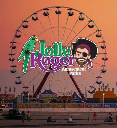 Giant wheel on boardwalk with Jolly Roger Amusements logo